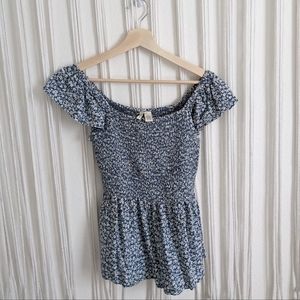 Smocked peplum flutter sleeve blouse